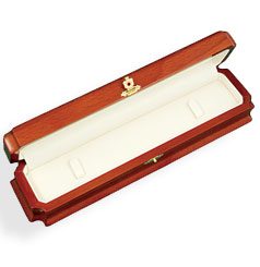 A wooden box with a white lid and a gold clasp.