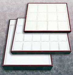 Three trays with a white lid and red trim.