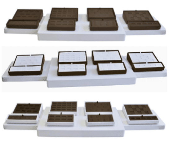 Three different trays of chocolate bars on a white tray.