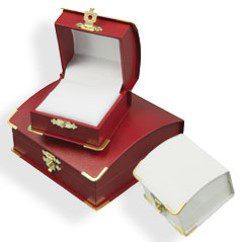 A red box with a white lid and a gold trim.