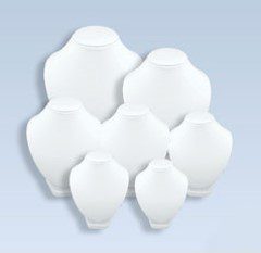 A group of white vases sitting on top of each other.