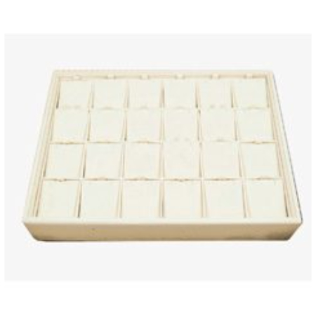 A white tray with many small squares of food.