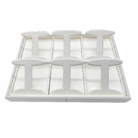 A white tray with six pieces of plastic