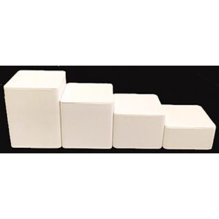 A group of four white blocks sitting on top of each other.