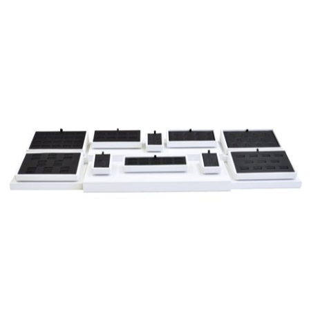 A white tray with black trays on top of it.