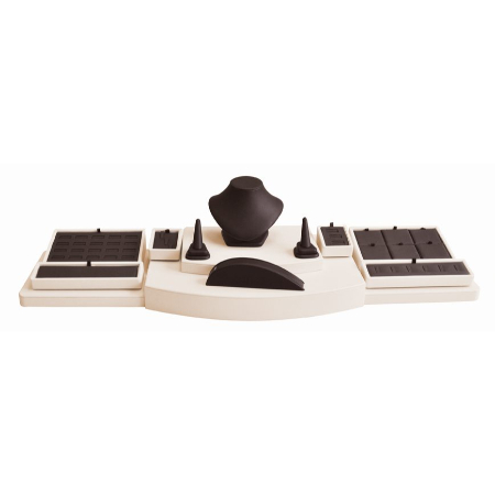 A white desk with black accessories on top of it.