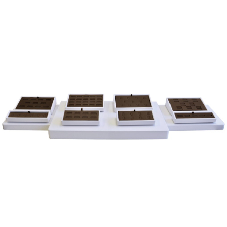 A set of four trays with different sized trays.