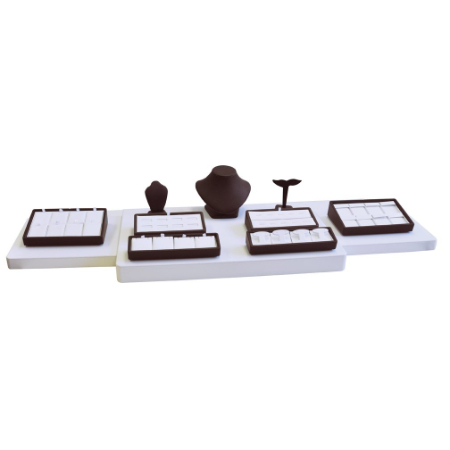 A set of jewelry trays with brown accents.