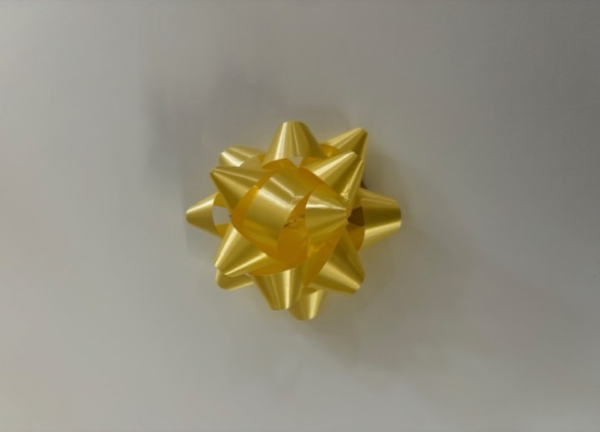 A yellow bow is on the wall